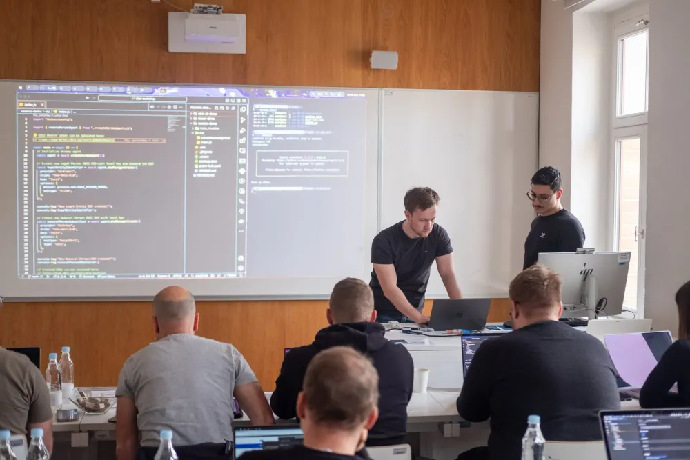 Students on laptops during the decentralized identity workshop.